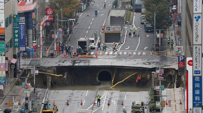 Giant Sinkhole Swallows Street In Japan