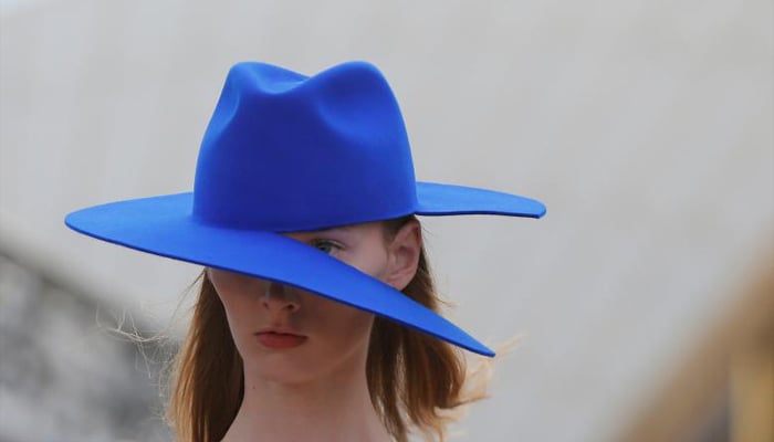 A model presents headwear with a split brim for Australian designer Dion Lee. REUTERS/Jason Reed