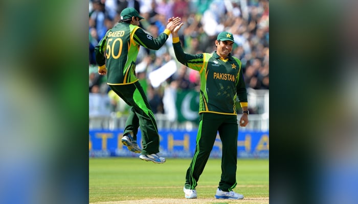 Misbah congratulated by Saeed Ajmal after a run out, Pakistan v South Africa, Champions Trophy, Edgbaston, June 10, 2013/AFP