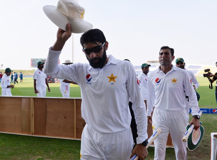 Leading his team off after clinching series against WI, Abu Dhabi, October 25, 2016/AFP