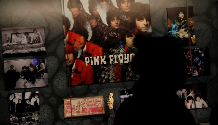 A woman is silhouetted at The Pink Floyd Exhibition: Their Mortal Remains at the V&A Museum in London, Britain May 9, 2017. REUTERS/Stefan Wermuth