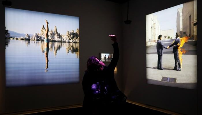 Visitors take a selfie at The Pink Floyd Exhibition: Their Mortal Remains at the V&A Museum in London, Britain May 9, 2017. REUTERS/Stefan Wermuth