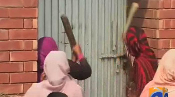 Armed with sticks power loom workers protest in Faisalabad