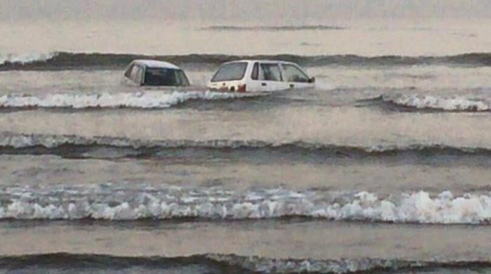 Cars spotted floating in the sea in Karachi