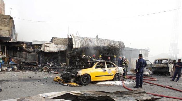 Bomb in Baghdad suburb kills at least 17: police sources