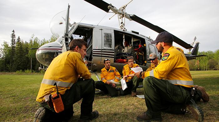 Canada firefighters battled wildfire as own homes burned down