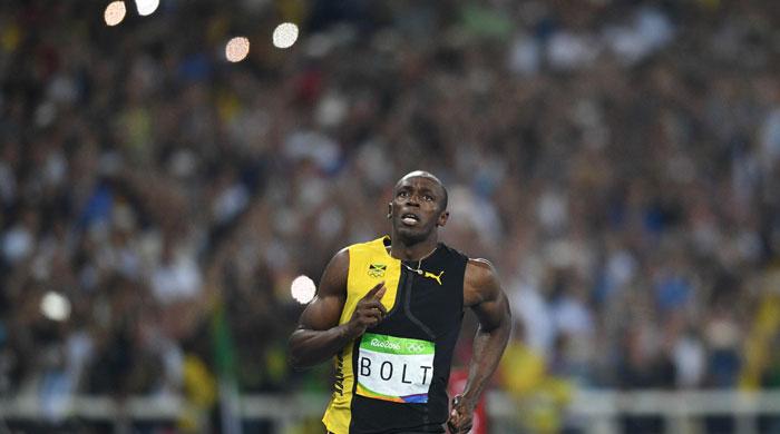 Olympics: Bolt triumphs and targets Olympic immortality