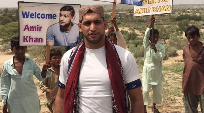 Boxer Amir Khan visits Thar, vows to build water wells