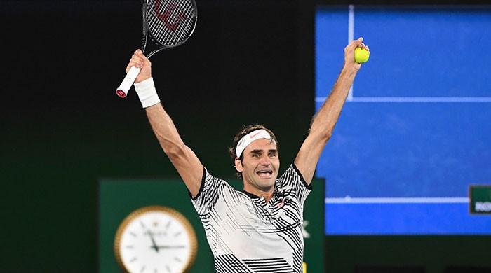 Tennis: Federer wins Nadal thriller to clinch 18th Slam