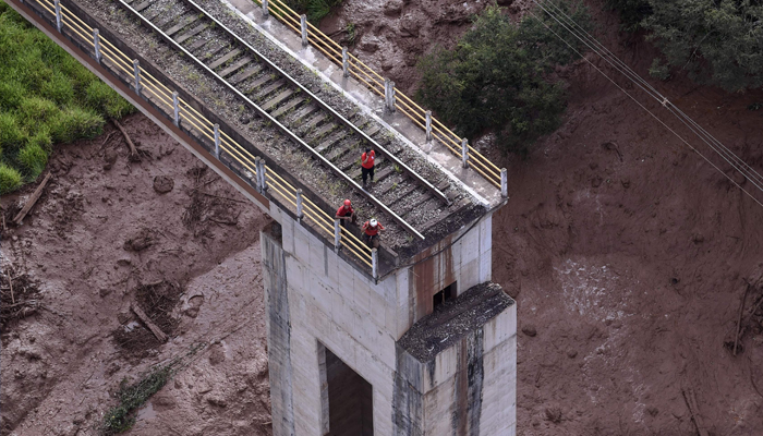 Seven bodies found after dam burst at Brazil mine, hundreds missing