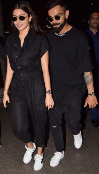 Anushka Sharma and Virat Kohli serve couple fashion goals with twinning  airport look - Video