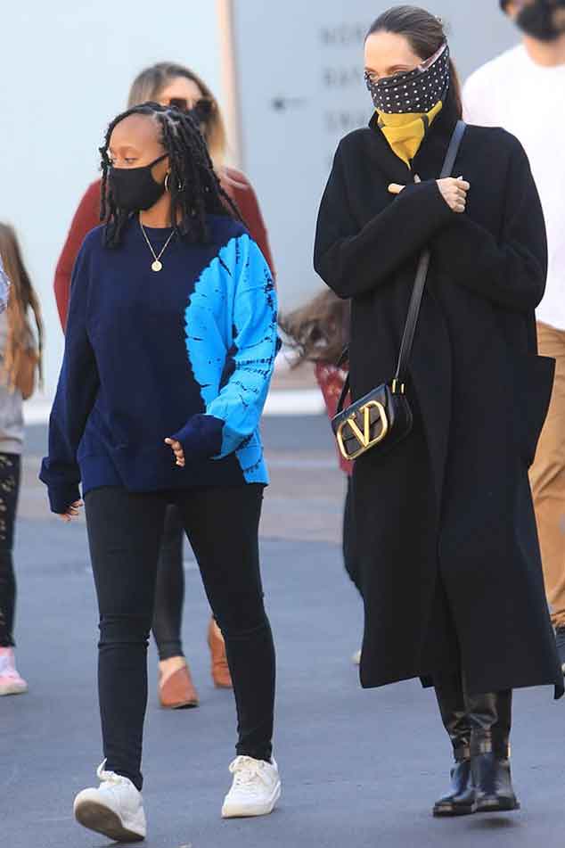 Angelina Jolie Goes Holiday Shopping With Daughter Zahara Wearing