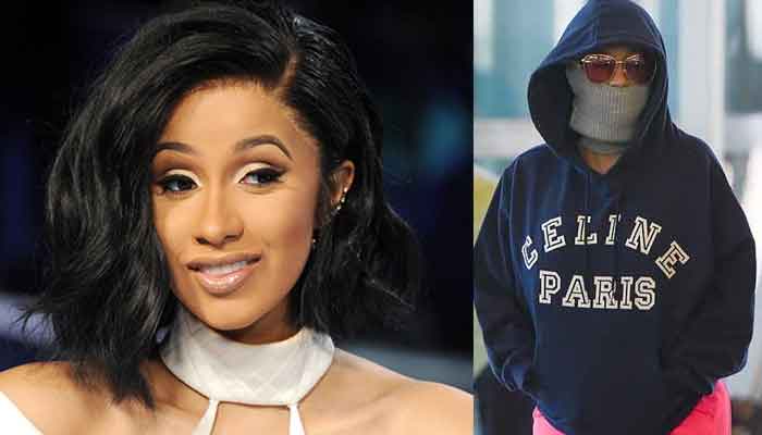 Cardi B dodges fans with her unusual getup at JFK Airport in NYC