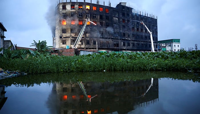 Flames rise the morning after a fire broke out at a factory named Hashem Foods Ltd. in Rupganj of Narayanganj district, on the outskirts of Dhaka, Bangladesh, July 9, 2021. — Reuters