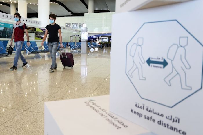 Travellers wearing protective face masks walk at Riyadh International Airport, after Saudi Arabia reopened domestic flights, following the outbreak of the coronavirus disease (COVID-19), in Riyadh, Saudi Arabia May 31, 2020. Photo: Reuters