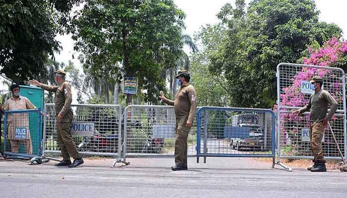 Police officials bar people from crossing the barricades. Photo courtesy: Jang