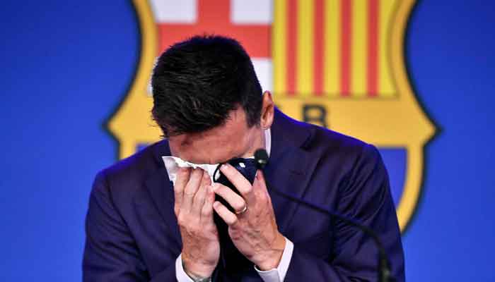 Barcelonas Argentinian forward Lionel Messi cries during a press conference at the Camp Nou stadium in Barcelona on August 8, 2021. — Photo by Pau Barrena/AFP