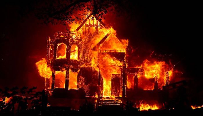 A home is seen fully engulfed in flames during the Glass Fire in St. Helena, California, U.S. September 27, 2020. Photo: Reuters