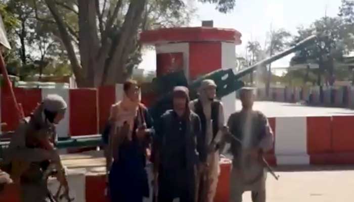 Taliban fighters gather on main road intersection in city of Ghazni, Afghanistan in this screen grab taken from a video released by the Taliban on August 12, 2021. -REUTERS