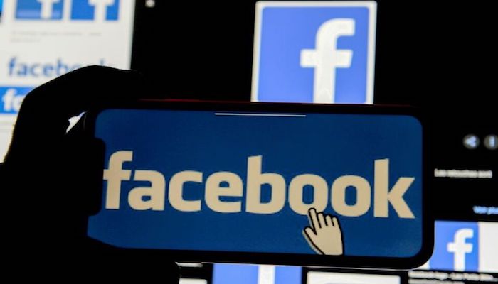 The Facebook logo is displayed on a mobile phone in this picture illustration taken December 2, 2019. Photo: Reuters