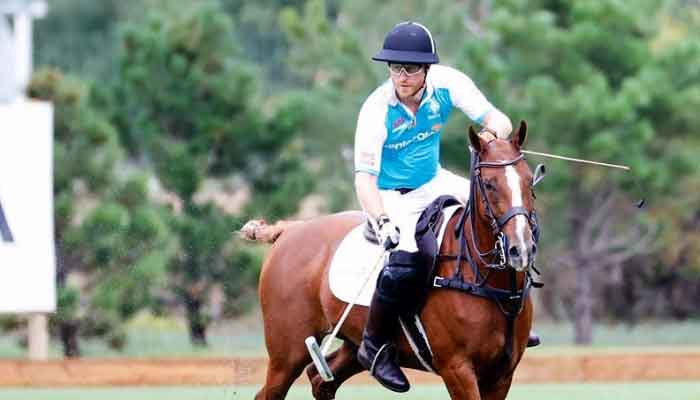 Prince Harry scores two goals in polo match to raise funds for vulnerable children