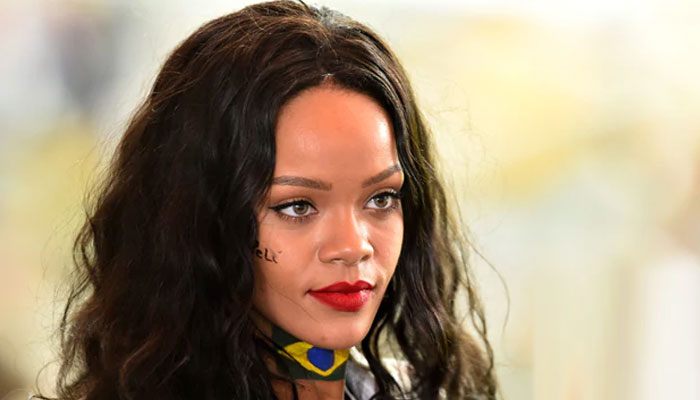 Rihanna sets pulses racing in skimpy red outfit