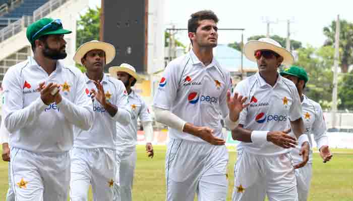 Shaheen Afridi (2R), Azhar Ali (L), Nauman Ali (2L) and Mohammad Abbas (R) of Pakistan walk off the field at the lunch break during day 4 of the 2nd Test between West Indies and Pakistan at Sabina Park, Kingston, Jamaica, on August 23, 2021.-AFP