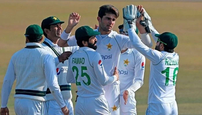 Shaheen Shah Afridi celebrates with teammates after getting a wicket. Photo: AFP