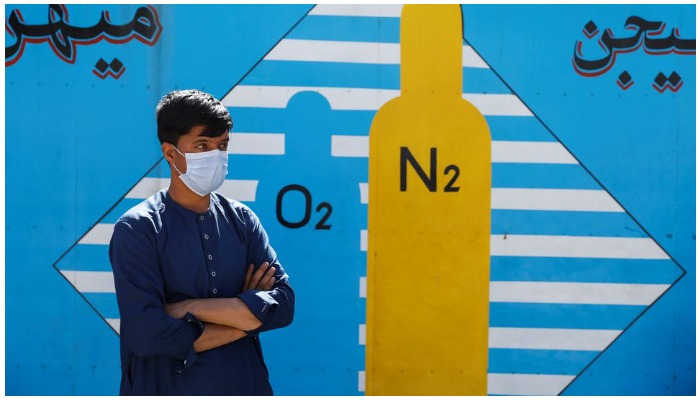 A man waits outside a factory to get his oxygen cylinder refilled, amidst the spread of the coronavirus disease (COVID-19) in Kabul, Afghanistan, June 15, 2021. — Reuters/Stringer