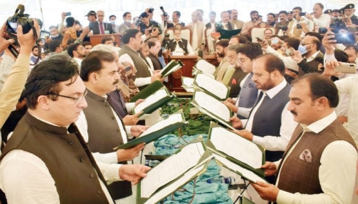 Elected members of AJK cabinet taking oaths as ministers. File photo