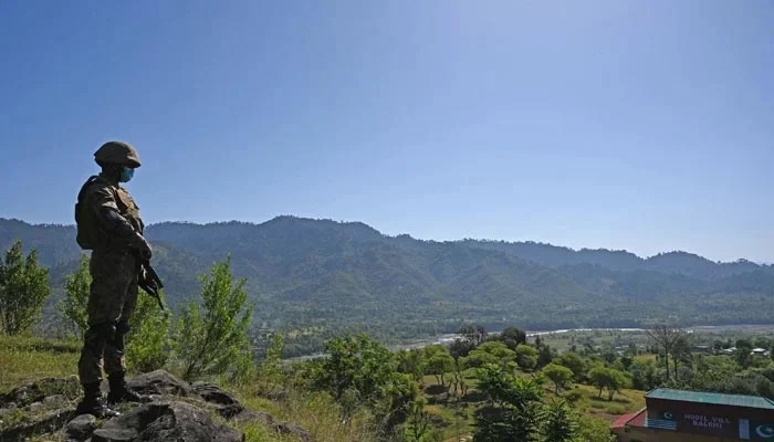 A Pakistani soldier stands guard near the Line of Control, de facto border between India and Pakistan at Salohi village in Poonch district of Azad Jammu and Kashmir on April 26, 2021. — AFP/File