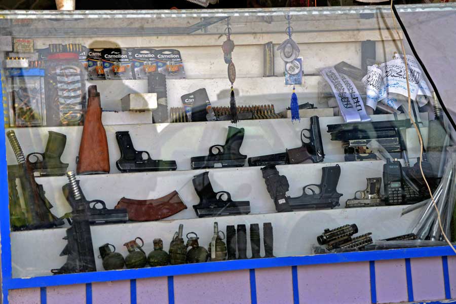 Pistols, hand grenades and ammunition are seen kept on display for sale at a shop in Panjwai district of Kandahar province on September 4, 2021.  — Javed Tanveer/AFP