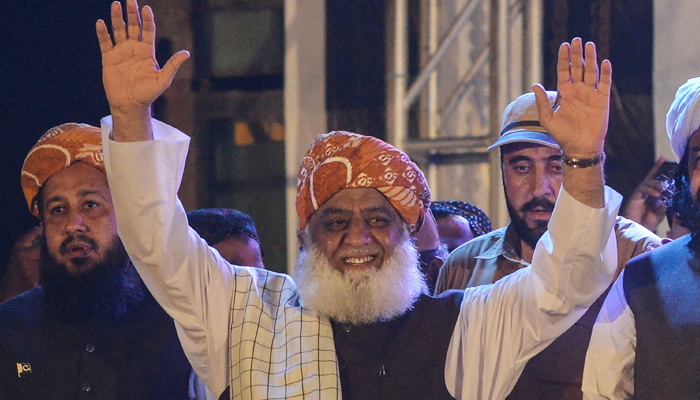 Maulana Fazlur Rehman, leader of the Pakistan Democratic Movement (PDM), an anti-government alliance of opposition parties, waves to supporters during an anti-Government rally in Karachi on August 29, 2021. — AFP/File