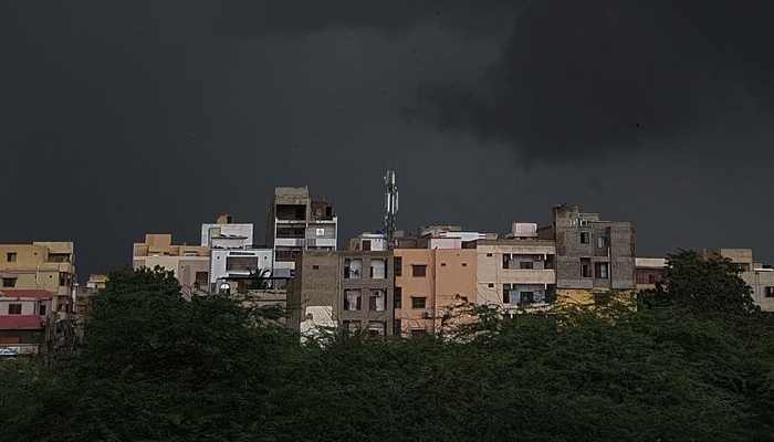 Dark storm clouds form over a building in Karachi. Photo: Wajahat Kazmi Twitter