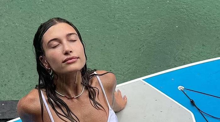 Hailey Bieber showcases her impressively fit figure in vacation snaps ...