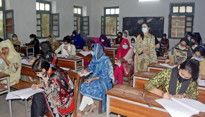 Students are busy solving their question papers during the matriculations annual examination at Government Post Graduate Islamia College in Lahore, on July 30. — ONLINE/File