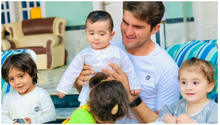 Shaheen Shah Afridi playing with some children of his family. Photo — Twitter/@iShaheenAfridi