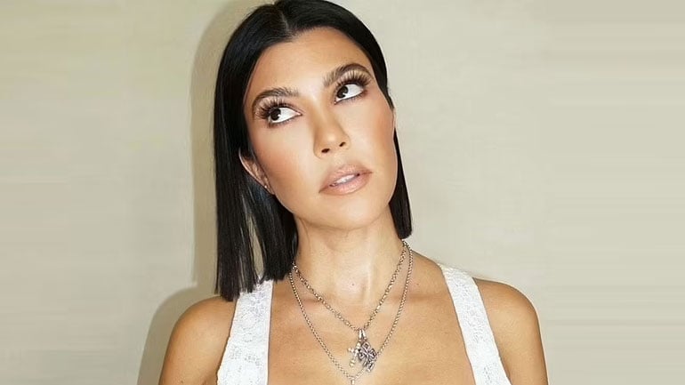 kourtney kardashian cross necklace