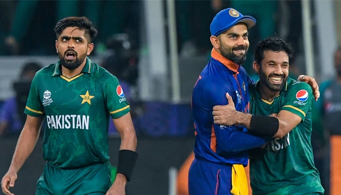 India´s captain Virat Kohli (C) congratulates his Pakistan´s counterpart Babar Azam (L) and Mohammad Rizwan following their victory during the ICC Twenty20 World Cup cricket match between India and Pakistan at the Dubai International Cricket Stadium in Dubai on October 24, 2021. — AFP/File