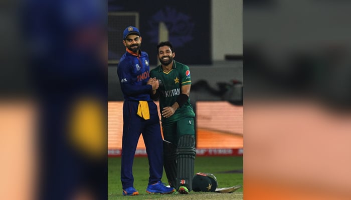 India´s captain Virat Kohli (L) greets Pakistan´s Mohammad Rizwan at the end of the ICC menâ€™s Twenty20 World Cup cricket match between India and Pakistan at the Dubai International Cricket Stadium in Dubai on October 24, 2021. — INDRANIL MUKHERJEE / AFP.