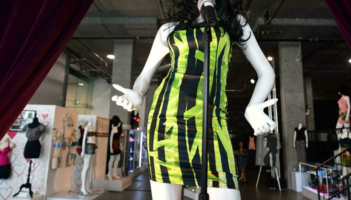 Winehouse wore the green and black bamboo print at a concert in Belgrade in 2011