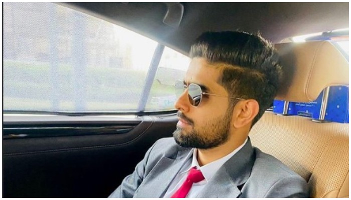 Pakistani cricket captain Babar Azam poses while sitting in a car. — Instagram