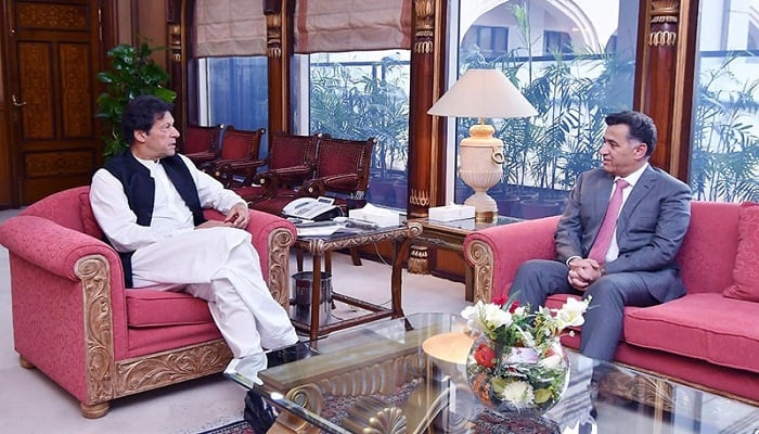 A file photo of Prime Minister Imran Khan in conversation with DG ISI Faiz Hameed at PM Office in Islamabad. Photo: Courtesy PM Office