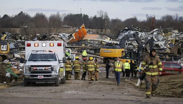 Emergency crews search through the debris of the flattened candle factory in Mayfield, Kentucky. AFP