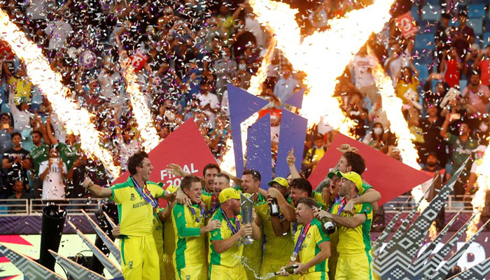 Cricket - ICC Mens T20 World Cup Final - New Zealand v Australia- Dubai International Cricket Stadium, Dubai, United Arab Emirates - November 14, 2021, Australia captain Aaron Finch celebrates with the trophy and teammates after winning the ICC Mens T20 World Cup. — Reuters