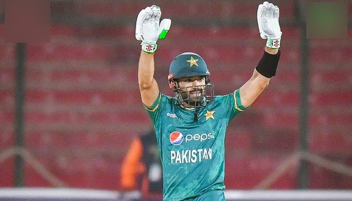 Pakistan wicketkeeper-batter Mohammad Rizwan raises hands for his fans after scoring an impressive half-century against West Indies in the first T20I match at the National Stadium in Karachi. — PCB/File