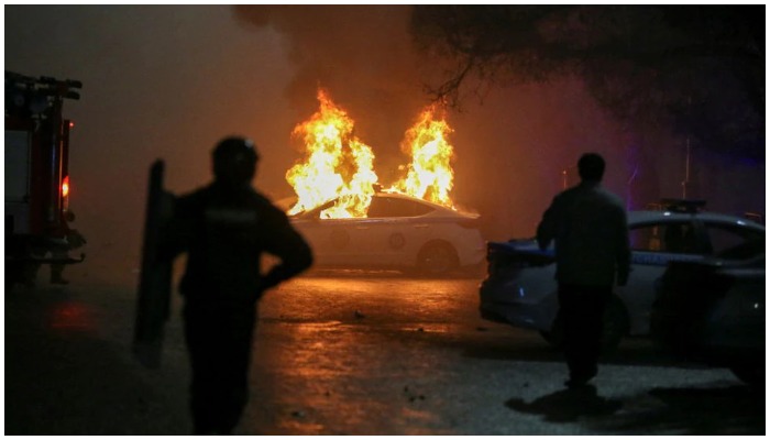 A view shows a burning police car during a protest against LPG cost rise following the Kazakh authorities decision to lift price caps on liquefied petroleum gas in Almaty, Kazakhstan January 5, 2022. Photo: Reuters