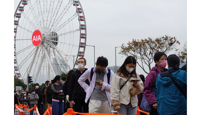 People queue at a makeshift nucleic acid testing centre for the coronavirus disease (COVID-19), at the Central district in Hong Kong, China on February 9, 2022. — Reuters/File