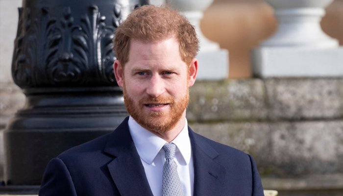 Prince Harry pictured in LA Rams locker room holding Super Bowl trophy  after watching game with Eugenie