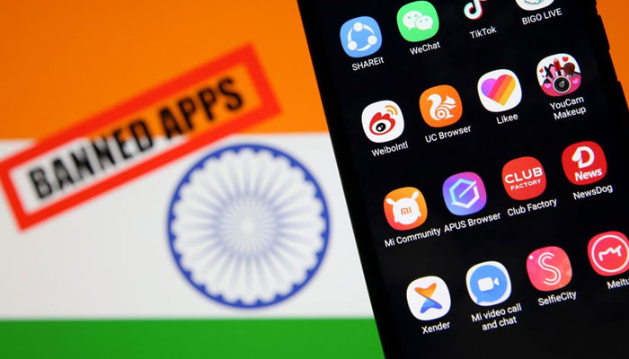 Smartphone with Chinese applications is seen in front of a displayed Indian flag and a Banned app sign in this illustration picture taken July 2, 2020. — Reuters/File